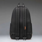 Black backpack on a gray background