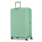A mint green hardshell spinner suitcase with a telescoping handle extended, shown on a clean white background.