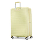 A pale yellow hard-shell spinner suitcase with a telescoping handle extended and four wheels, shown on a clean white background.
