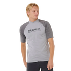 Person wearing a gray and black Rip Curl rash ves on a white background