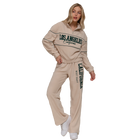 Model wearing Wide Leg Piping Detail Fleece Pants with Embroidery - Cream