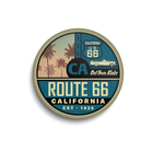 Round sticker with Route 66 California design featuring palm trees and classic car.