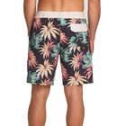 Tropical floral patterned shorts on a plain background back view