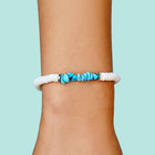 Model wearing Pura Vida Puka Shell and Turquoise Chip Stretch Bracelet