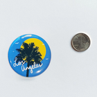 Los Angeles California Palm Tree Magnet - Blue beside quarter dollar