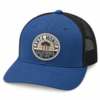 A blue and black trucker hat with a circular embroidered 'Santa Monica California' patch on the front, shown against a plain white background.