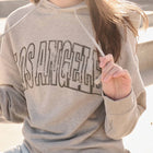Model wearing grey hoodie