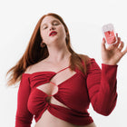 Model holding Wild Watermelon Power Mist Hydrating Hand Sanitizer 