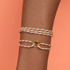 Model wearing Pura Vida Friendship Ring Bracelet creamsicle