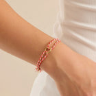 Model wearing Pura Vida Friendship Ring Bracelet Red