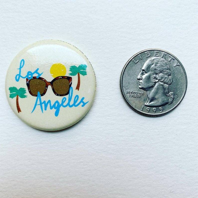 Los Angeles California Magnet  beside a coin