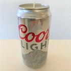 Coors Light beer can with a candle inside on a white background