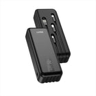 Black power bank with multiple ports on a white background