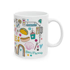 White mug with colorful graphics and text on a white background