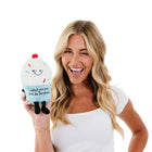Woman holding a plush ice cream toy with a white background