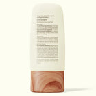 Skincare product with wooden base on a white background