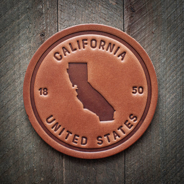 Sugarhouse California State Silhouette Leather Coaster on wooden background
