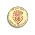 Round button with California Route 66 design on a yellow background