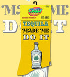 Yellow novelty socks with a repeating pattern of tequila bottles and the text 'TEQUILA MADE ME DO IT', shown as a pair on a white background and also hanging on a yellow card against a pale yellow backdrop. The Crazy Socks logo appears in the top left.