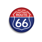 A circular button badge featuring the classic Route 66 highway shield design, with a red top half, blue bottom half, and white text reading 'EST. 1926' and 'ROUTE 66'.