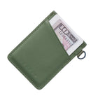 Green wallet with a card and money clip on a white background