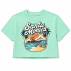 A mint green short-sleeve crop top t-shirt featuring a retro-style 'Santa Monica, California' graphic print on the front, displayed against a solid white background.