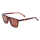Sunglasses with red tortoiseshell frame and brown lenses on a white background