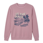 Pink sweatshirt with 'At the Beach' graphic design on a white background