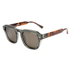 Sunglasses with tortoiseshell frame and clear lenses on a white background