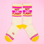 Cream-colored socks with 'Hot and Flashy' text and yellow accents on a pink background