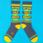Pair of socks with humorous text design on a blue background