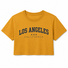 A cropped short-sleeve t-shirt in mustard yellow with 'LOS ANGELES CALIFORNIA' printed in navy blue across the chest, displayed on a clean white background.