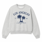 A light heather gray crewneck sweatshirt with a navy blue graphic on the front featuring the text 'LOS ANGELES', 'California', '17 81', and two palm trees, displayed on a clean white background.