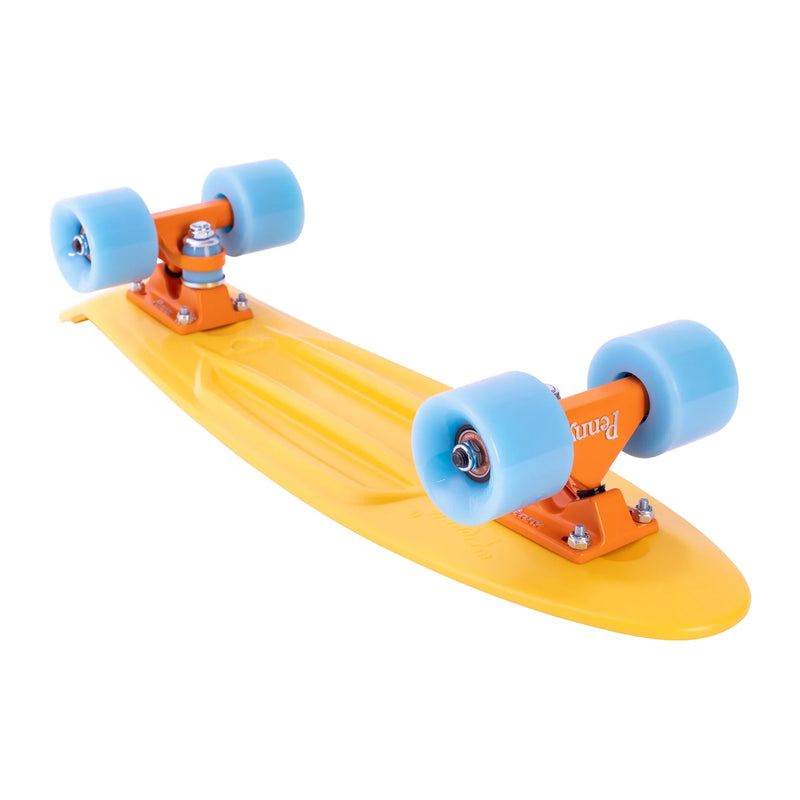 An underside view of the yellow Penny skateboard, displaying the trucks, wheels, and structural details of the plastic deck