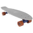 A side-angle view of a grey Penny skateboard with brown wheels, showcasing its compact design and smooth-rolling wheels.