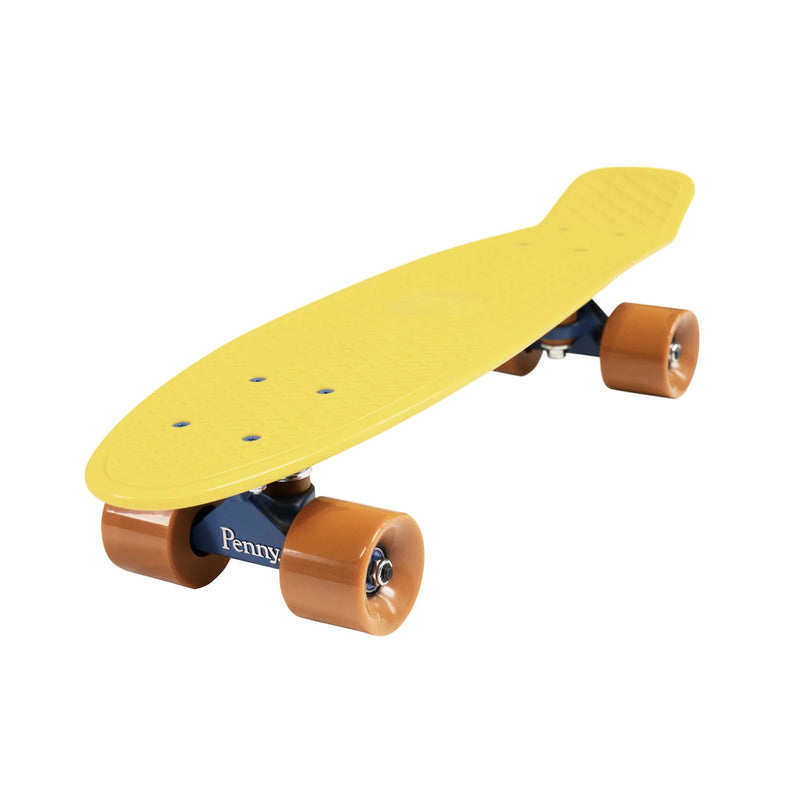 A side-angle view of a yellow Penny skateboard with brown wheels, showcasing its compact design and smooth-rolling wheels.