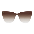 A pair of oversized cat-eye sunglasses with a brown-to-white gradient lens and a small circular gold logo on the left frame corner, shown against a plain white background.