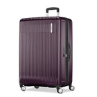 Purple suitcase with wheels on a white background