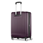 A hard-shell spinner suitcase in a deep plum purple color with vertical ribbing, featuring an extended silver telescopic handle and four multi-directional wheels, shown against a plain white background.