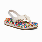 A single toddler thong sandal with a cream-colored strap and a thick, textured footbed covered in small multicolored polka dots, shown on a plain white background.