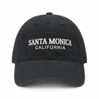 A black washed baseball cap with 'SANTA MONICA CALIFORNIA' embroidered in white on the front, shown against a plain white background.