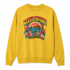A mustard crewneck sweatshirt featuring a colorful retro-style graphic on the front with the words 'SANTA MONICA' and 'CALIFORNIA' surrounding a beach scene with palm trees, flowers, and a sunset.