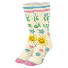 Colorful socks with smiley faces, flowers, and text on a white background