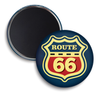 Two round refrigerator magnets showing the front and back designs. The front magnet features a Route 66 shield emblem in red, yellow, and navy blue, while the back magnet shows a plain dark gray magnetic surface.