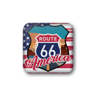 A square magnet with rounded corners featuring a distressed Route 66 America design. The design includes a classic blue and red Route 66 shield in the center, overlaid with 'America' in red script, set against a background of an American flag and a western landscape.