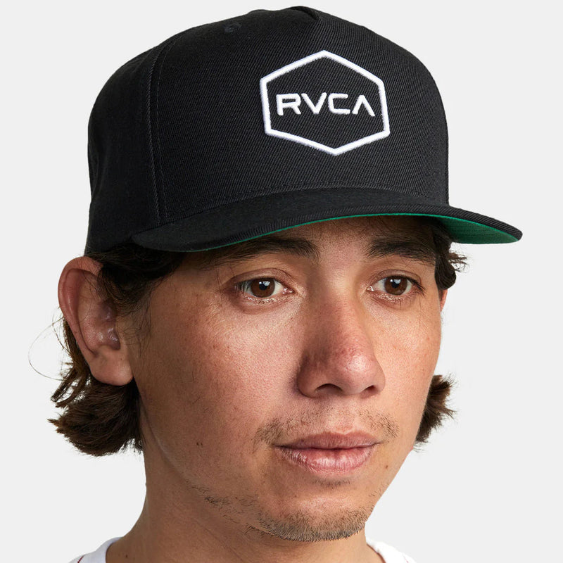 Model wearing RVCA Commonwealth Snapback Hat - Black/White