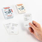 Travel trivia game with cards and packaging on a white background