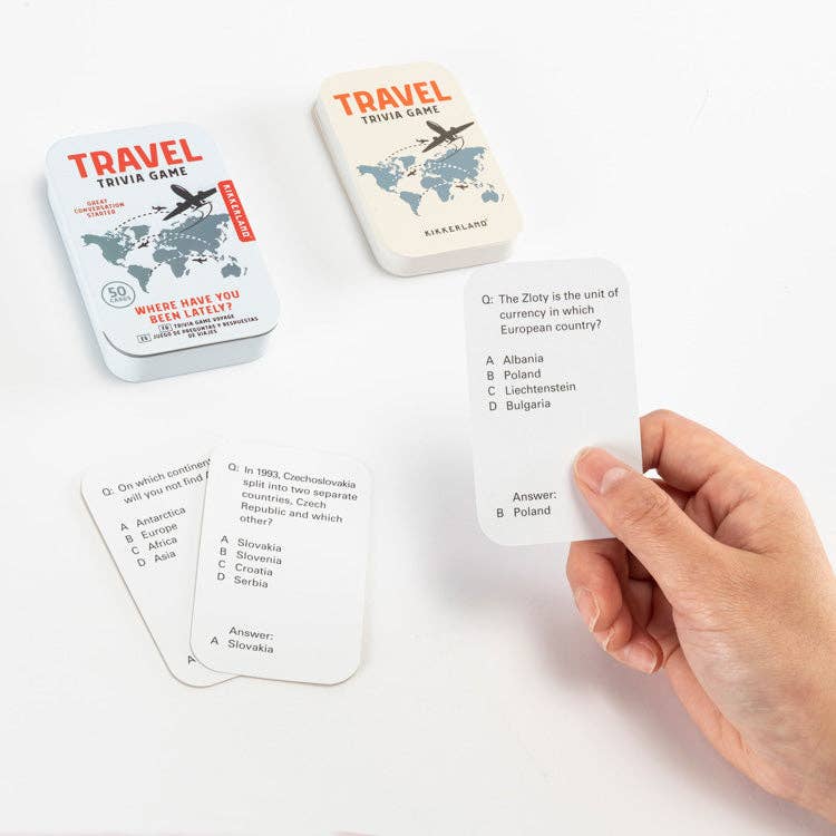 Travel trivia game with cards and packaging on a white background