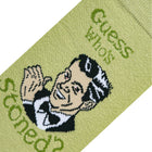Green fabric with a cartoon character and text on a white background