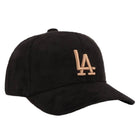 Black cap with gold 'LA' logo on a white background